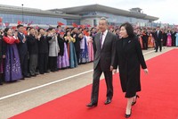 China's top diplomat Wang Yi, left front, and his North Korean counterpart Choe Son Hui walk together at North Korea's Pyongyang International Airport on April 9, 2026, after Wang's arrival. (Kyodo)