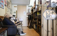 Visitors listen to a vinyl record at the Kawai community center in Fukui, Japan, on Jan. 28, 2026. (Kyodo)