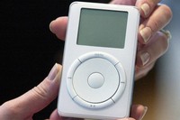An iPod is displayed after its introduction by Apple CEO Steve Jobs during a news conference, Oct. 23, 2001, in Cupertino, Calif. (AP Photo/Julie Jacobson, File)