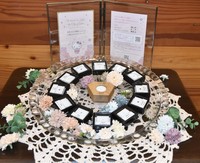Birthstones to be offered to babies born in the city of Kofu are on display, surrounding a case made of jolcham oak produced in Yamanashi Prefecture, on April 9, 2026. (Mainichi/Shusaku Sugimoto)