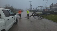 A utility pole blocks the road in Saipan on April 15, 2026, as a super typhoon with ferocious winds and relentless rains, shredded tin roofs and forced residents to take cover from flying tree limbs. (Office of the Mayor, municipality of Saipan via AP)