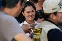 Keiko Fujimori, presidential candidate of the Popular Force party, lines up to vote during general elections in Lima, Peru, April 12, 2026. (AP Photo/Bruno Elias)