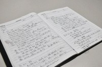 This partially modified photo taken in Hyogo Prefecture on March 27, 2026, shows a notebook of Koji Kiyoshima, filled with meeting notes and tasks to be addressed. Kiyoshima took his own life after being assigned overseas by Kawasaki Heavy Industries Ltd. (Mainichi/Ayumu Iwasaki) 