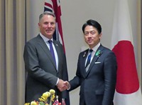 Japanese Defense Minister Shinjiro Koizumi, right, and his Australian counterpart Richard Marles shake hands before their talks in Melbourne on April 18, 2026. (Kyodo) 
