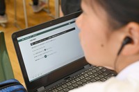 A student sits the online English listening component of the 2026 national achievement test at a junior high school in Tokyo on April 20, 2026. (Pool photo)
