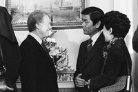 Hawaii Gov. George Ariyoshi, center, and his wife Jean chat with President Jimmy Carter during a White House reception for governors in Washington, Jan. 21, 1977. (AP Photo, File)