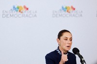 Mexican President Claudia Sheinbaum addresses the media at the Meeting in Defence of Democracy summit, in Barcelona, Spain, April 18, 2026. (AP Photo/Joan Monfort)