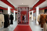 Visitors enjoy an installation of the new movie 'The Devil Wears Prada 2' at La Rinascente shopping center, in Milan, Italy, April 20, 2026. (AP Photo/Luca Bruno)