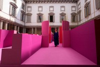 Designer Lina Ghotmeh walks through her installation 'Metamorphosis in motion' at Palazzo Litta, during the Design Week in Milan, Italy, April 20, 2026. (AP Photo/Luca Bruno)