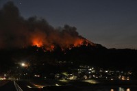 A wildfire approaches the Kirikiri district of Otsuchi, Iwate Prefecture, northeastern Japan, on the evening of April 24, 2026. (Kyodo) 