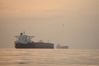 Tankers are seen anchored in the Strait of Hormuz off the coast of Qeshm Island, Iran, April 18, 2026. (AP Photo/Asghar Besharati)
