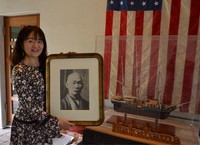 Kyo Nakahama, the great-great-granddaughter of John Manjiro, rejoices at the decision to adapt his story into NHK's historical drama, in Nagoya's Tempaku Ward, on April 21, 2026. The model ship on the right is the whaling vessel John Howland, which rescued Manjiro. (Mainichi/Shinichiro Kawase)