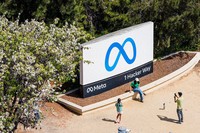Visitors take photos at a sign outside Meta headquarters March 26, 2026, in Menlo Park, Calif. (AP Photo/Noah Berger, File)