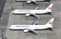 This Oct. 27, 2020 file photo shows JAL planes parked at Haneda Airport. (Mainichi)