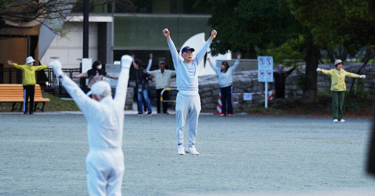 Japan awakens to Radio Taiso exercise tradition. One face of the country's longevity