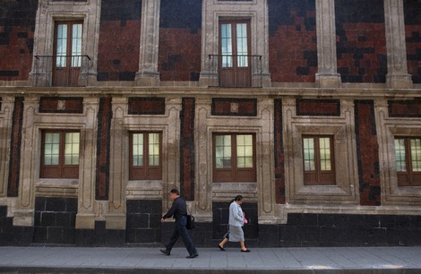 Pedestrians walk past a slightly tilted historic building in downtown Mexico City, June 15, 2016. The city was built on a drained lake bed and many buildings are noticeably tilted, from sinking unevenly into the soft earth over decades or centuries. (AP Photo/Rebecca Blackwell, File)