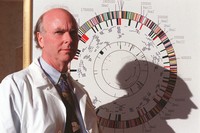 J. Craig Venter poses before a gene map of a flu-causing bacterium at his office in Rockville, Md., March 12, 1997. (AP Photo/Ruth Fremson, File)