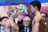 Undisputed super bantamweight world champion Naoya Inoue (L) and challenger Junto Nakatani stare each other down at their weigh-in in Tokyo on May 1, 2026, a day before their title match. (Kyodo)