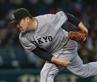 Masahiro Tanaka of the Yomiuri Giants pitches during a Central League game against the Hanshin Tigers at Koshien Stadium in Hyogo Prefecture on May 1, 2026. (Kyodo)