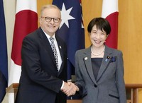 Japanese Prime Minister Sanae Takaichi, right, and her Australian counterpart Anthony Albanese shake hands before their meeting in Canberra on May 4, 2026. (Kyodo)