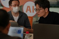 People install RedClaw AI software on their laptops in Beijing on March 22, 2026. (AP Photo/Andy Wong)