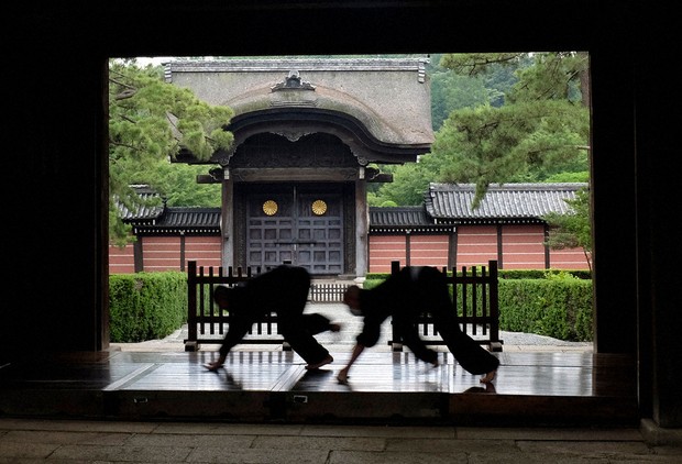 Monks polish the wooden corridor of the walkway that connects between temple buildings at Soji-ji in Yokohama, Japan on July 5, 2016. (AP Photo/Kiichiro Sato, File)
