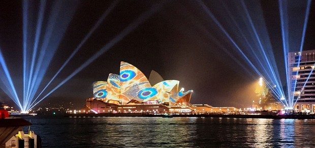 This photo shows the Sydney Opera House illuminated with light projections as part of the Vivid Sydney festival on May 22, 2026. (Kyodo)